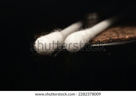 a cotton swab, or cotton swab, is an object consisting of one or two wads of cotton wound around one or both ends of a short rod made of wood, rolled paper or plastic