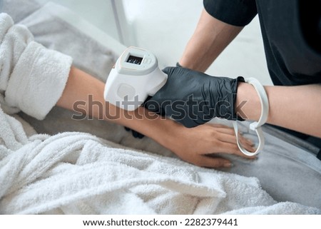 Close up photo of laser hair removal course on hands