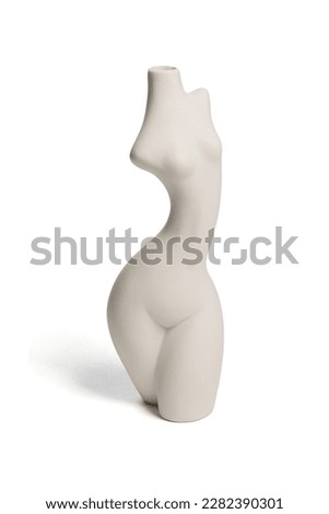 Close-up shot of a white empty ceramic female body shaped vase with a narrow neck isolated on a white background. Modern home decor element. Front view. Royalty-Free Stock Photo #2282390301