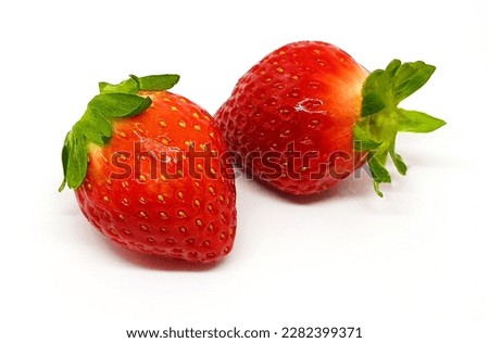 Fresh two strawberry or red berry isolated on white background with clipping path or make selection. Healthy food and Fruit.