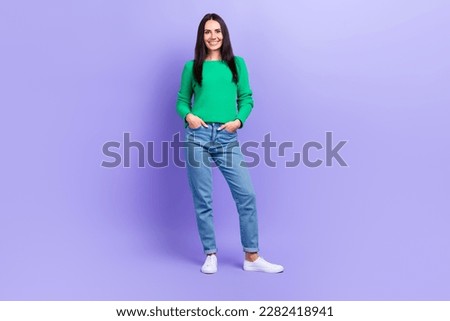 Full length photo of stunning lady promoting new clothes collection posing on camera isolated purple color background