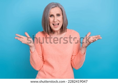 Portrait of angry furious offended senior person with bob hairdo wear pink shirt scream in conflict isolated on blue color background Royalty-Free Stock Photo #2282419047