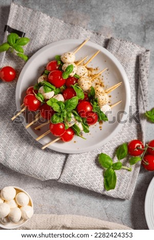Simple and beautiful food with basil, mozzarella and balsamico