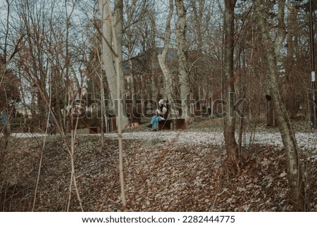 Woman sitting alone in the park