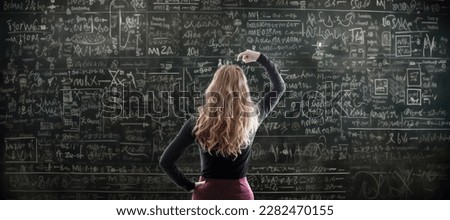 pensive woman with mathematical formulas Royalty-Free Stock Photo #2282470155