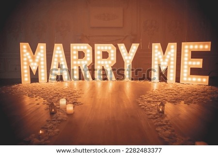 Marry Me Decor setup with marquee letters Royalty-Free Stock Photo #2282483377