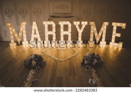 Marry Me Decor setup with marquee letters Royalty-Free Stock Photo #2282483383