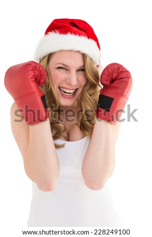 Blonde woman wearing boxing gloves smiling at camera on white background