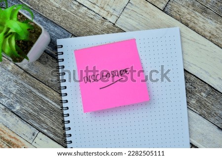 Concept of Disclosure write on sticky notes isolated on Wooden Table.