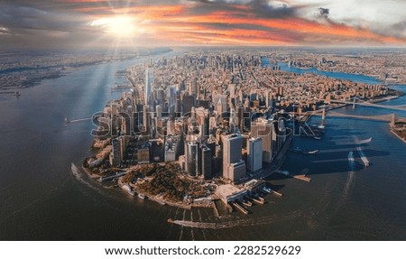 Beautiful sunset over Manhattan island in New York city. Aerial New York view from above.