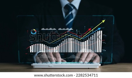 Concept of planning and strategy. Stock market. Business growth. progress or success idea A businessman or trader is showing a growing virtual hologram stock.