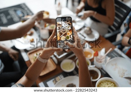 Person taking pictures to the food