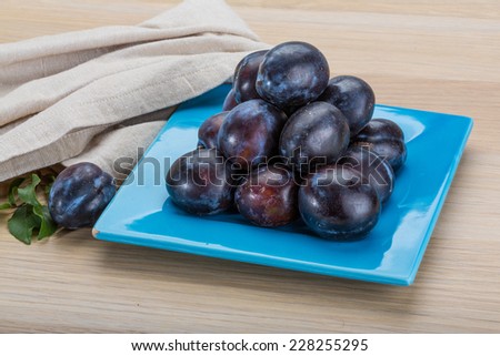 Ripe fresh plums in the bowl