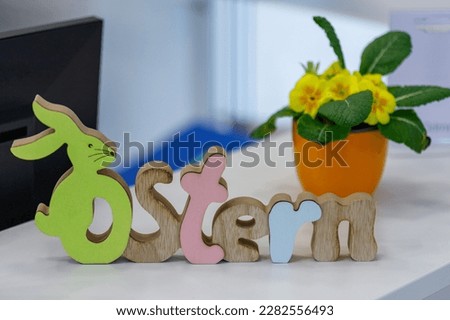 german rustic word-ostern-. Colorful flowers in spring. Postcard and background.