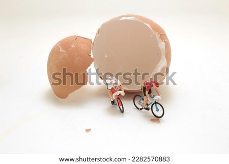 mini figure ride the bike with egg shell