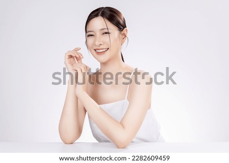 Beauty portrait of happy Asian female face with natural skin make up isolated on white background.
