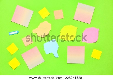 Composition with sticky notes on green background