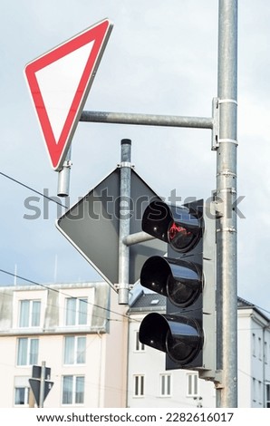 View of traffic lights with sign in city, closeup