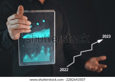 Businessman Use a laptop to analyze sales data and graph economic growth. Planning and business strategy Analysis of forex trading Finance and banking. Digital marketing technology.

