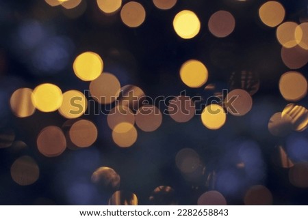 Festive backdrop fot your text or design. holiday illumination and decoration concept. Colorful defocused bokeh lights in blur night background. Defocused image. Royalty-Free Stock Photo #2282658843