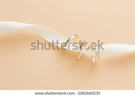 Wedding ring photography is an important part of a wedding photoshoot, capturing the elegance and significance of a couple's love and commitment. These close-up shots highlight the intricate details o Royalty-Free Stock Photo #2282660235