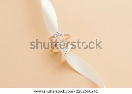 Wedding ring photography is an important part of a wedding photoshoot, capturing the elegance and significance of a couple's love and commitment. These close-up shots highlight the intricate details o Royalty-Free Stock Photo #2282660241