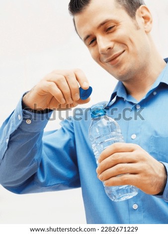 Man opening a water bottle