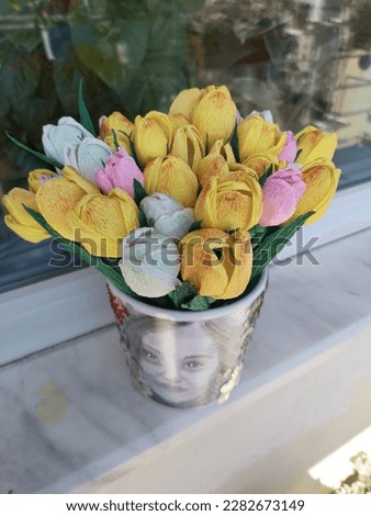 Unusual handmade flower pots.Painted pictures in flower pots.