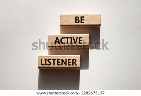 Be active listener symbol. Wooden blocks with words Be active listener. Beautiful white background. Business and active listening concept. Copy space. Royalty-Free Stock Photo #2282675117
