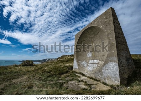 The old acoustic sound mirror on Abbot's Cliff between Folkestone and Dover. It was used to monitor enemy aircraft before the introduction of Radar. Royalty-Free Stock Photo #2282699677