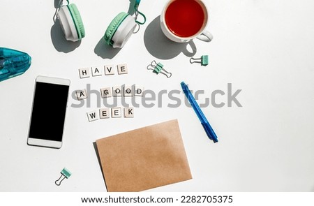 'have a good week' wording and metal paper clips isolated over white background, business concept, memory reminder paper, work or educational tools. High quality photo