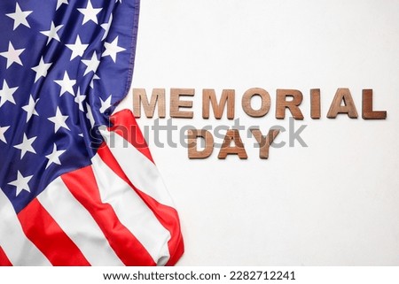 Text MEMORIAL DAY with USA flag on white background