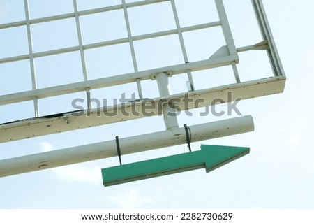 Empty billboard frame with a green arrow attached.