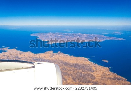 Paros and Nexos islands seen from flying airplane to Santorini.Greek islands in the Cyclades group in the Aegean Sea. Picture taken September 4th,2013