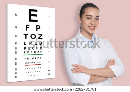 Vision test. Ophthalmologist or optometrist near eye chart, pink background