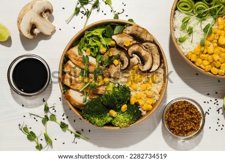 Bowls with tasty and nutritious food, top view Royalty-Free Stock Photo #2282734519
