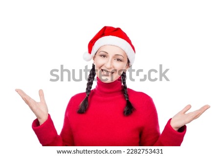Girl in Santa Hat showing, presenting with two hands open empty for product or text. Isolated on a white background.
