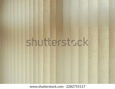 Textile texture. Ambient natural light graduated with blinds with adjustable vertical slats made of fireproof fabric and placed on the large windows Royalty-Free Stock Photo #2282755117