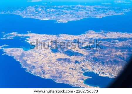 Paros and Nexos islands seen from flying airplane to Santorini.Greek islands in the Cyclades group in the Aegean Sea. Picture taken September 4th,2013