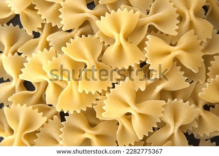 Food vector photography of Butterflies pasta, ingredients of typical italian cuisine.  Royalty-Free Stock Photo #2282775367