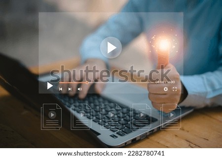 Man using mouse and keyboard for streaming online on virtual screen, watching video on internet, live concert, show or tutorial, content online.