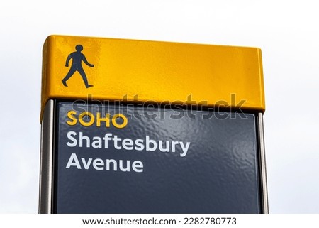 A pedestrian sign located on Shaftesbury Avenue, in the Soho area of London, UK.