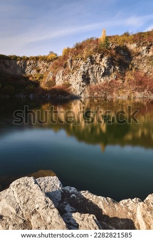 Natural conceptual autumn idea. Quarry landscape with leaves in fall colors. Photo taken in Kielce, Poland. 