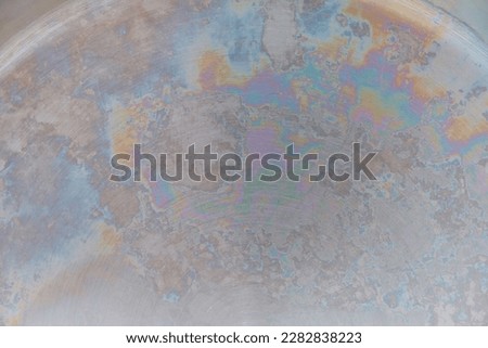 abstract metallic background, rainbow color on metal, interference of light waves in an oxide film Royalty-Free Stock Photo #2282838223