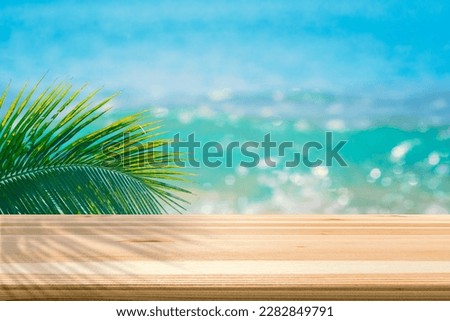 Wooden table on seascape for placing text, products or beverage. for the summer Royalty-Free Stock Photo #2282849791