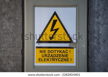 sign prohibiting touching the electrical device