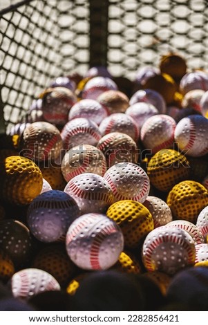 Baseballs at a batting cage Royalty-Free Stock Photo #2282856421