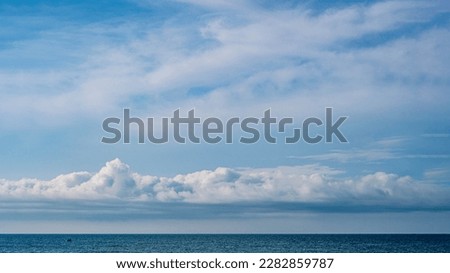 Atmosphere panorama real photo beautiful summer white cloud clear blue sky horizon line calm empty sea. Concept paradise life. Design relax wallpaper background. More tone format collection in stock