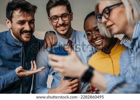 Close up image of a Business Team Celebrating a Birthday of a Female Colleague in the Modern Office, Taking a group selfie and Feels Happiness and Enjoyment.