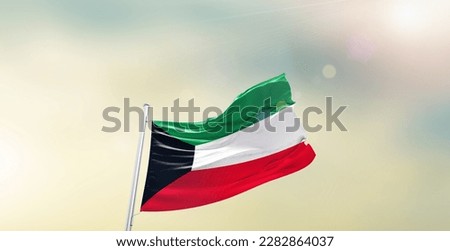 Kuwait national flag waving in beautiful sky. Royalty-Free Stock Photo #2282864037